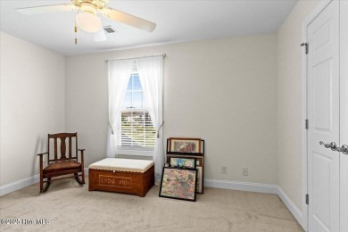 This inviting second-floor condo in the gated community of on Brunswick Plantation and Golf Resorts in North Carolina - for sale on GolfHomes.com, golf home, golf lot