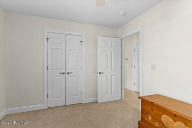This inviting second-floor condo in the gated community of on Brunswick Plantation and Golf Resorts in North Carolina - for sale on GolfHomes.com, golf home, golf lot