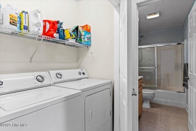 This inviting second-floor condo in the gated community of on Brunswick Plantation and Golf Resorts in North Carolina - for sale on GolfHomes.com, golf home, golf lot
