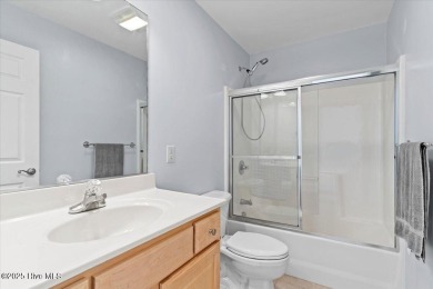 This inviting second-floor condo in the gated community of on Brunswick Plantation and Golf Resorts in North Carolina - for sale on GolfHomes.com, golf home, golf lot