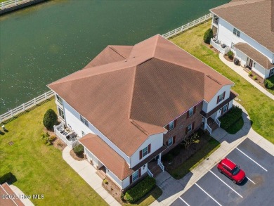 This inviting second-floor condo in the gated community of on Brunswick Plantation and Golf Resorts in North Carolina - for sale on GolfHomes.com, golf home, golf lot