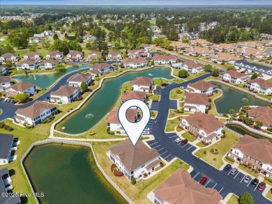 This inviting second-floor condo in the gated community of on Brunswick Plantation and Golf Resorts in North Carolina - for sale on GolfHomes.com, golf home, golf lot