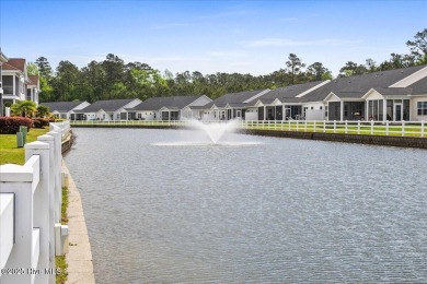 This inviting second-floor condo in the gated community of on Brunswick Plantation and Golf Resorts in North Carolina - for sale on GolfHomes.com, golf home, golf lot