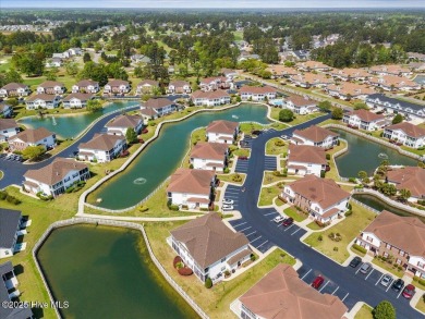 This inviting second-floor condo in the gated community of on Brunswick Plantation and Golf Resorts in North Carolina - for sale on GolfHomes.com, golf home, golf lot