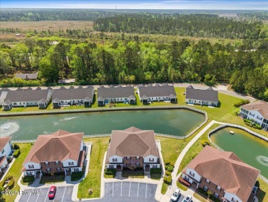 This inviting second-floor condo in the gated community of on Brunswick Plantation and Golf Resorts in North Carolina - for sale on GolfHomes.com, golf home, golf lot