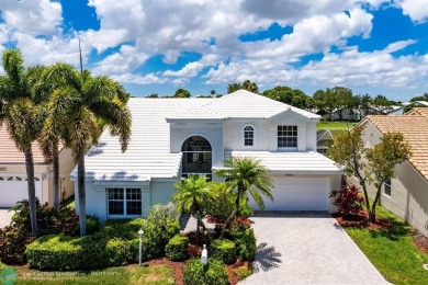 With serene views of the water and golf course, a 2021 roof, and on The Boca Country Club in Florida - for sale on GolfHomes.com, golf home, golf lot