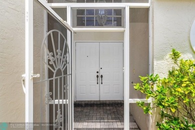 With serene views of the water and golf course, a 2021 roof, and on The Boca Country Club in Florida - for sale on GolfHomes.com, golf home, golf lot