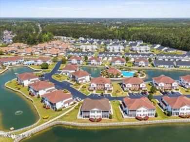 This inviting second-floor condo in the gated community of on Brunswick Plantation and Golf Resorts in North Carolina - for sale on GolfHomes.com, golf home, golf lot