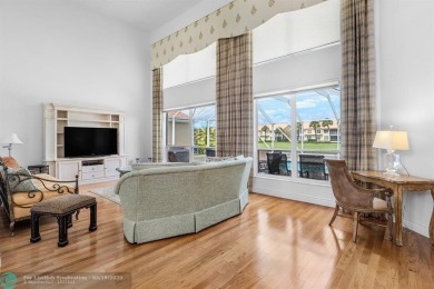 With serene views of the water and golf course, a 2021 roof, and on The Boca Country Club in Florida - for sale on GolfHomes.com, golf home, golf lot