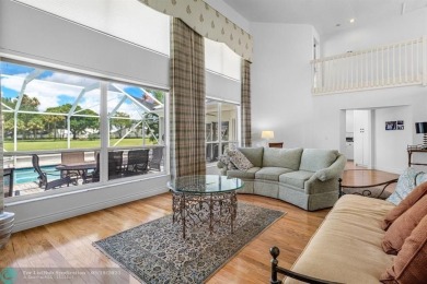 With serene views of the water and golf course, a 2021 roof, and on The Boca Country Club in Florida - for sale on GolfHomes.com, golf home, golf lot