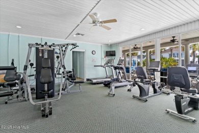 This inviting second-floor condo in the gated community of on Brunswick Plantation and Golf Resorts in North Carolina - for sale on GolfHomes.com, golf home, golf lot