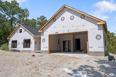 Tucked inside a gated golf community, this newly constructed on Ledgestone Country Club and Golf Course in Missouri - for sale on GolfHomes.com, golf home, golf lot