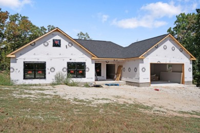 Tucked inside a gated golf community, this newly constructed on Ledgestone Country Club and Golf Course in Missouri - for sale on GolfHomes.com, golf home, golf lot
