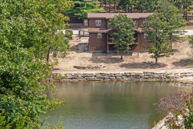 Tucked inside a gated golf community, this newly constructed on Ledgestone Country Club and Golf Course in Missouri - for sale on GolfHomes.com, golf home, golf lot