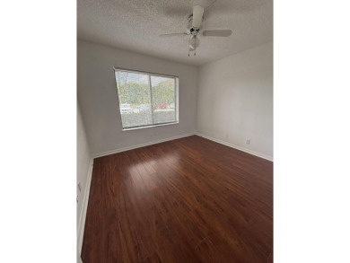 Beautiful first floor unit 2 beds/ 2 baths with a lake view in a on Forest Oaks Golf Club in Florida - for sale on GolfHomes.com, golf home, golf lot