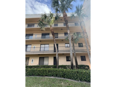 Beautiful first floor unit 2 beds/ 2 baths with a lake view in a on Forest Oaks Golf Club in Florida - for sale on GolfHomes.com, golf home, golf lot
