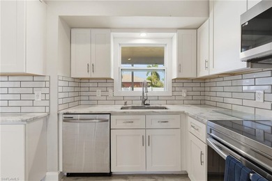 Step into a home where modern luxury meets timeless character on Royal Tee Country Club in Florida - for sale on GolfHomes.com, golf home, golf lot