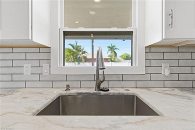 Step into a home where modern luxury meets timeless character on Royal Tee Country Club in Florida - for sale on GolfHomes.com, golf home, golf lot