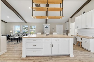 Step into a home where modern luxury meets timeless character on Royal Tee Country Club in Florida - for sale on GolfHomes.com, golf home, golf lot