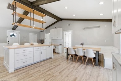 Step into a home where modern luxury meets timeless character on Royal Tee Country Club in Florida - for sale on GolfHomes.com, golf home, golf lot