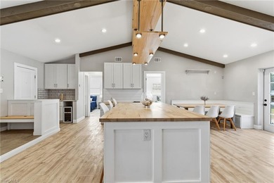 Step into a home where modern luxury meets timeless character on Royal Tee Country Club in Florida - for sale on GolfHomes.com, golf home, golf lot