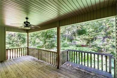 Beautifully landscaped and surrounded by mature trees! This on Bella Vista - Metfield Golf Complex and Country Club in Arkansas - for sale on GolfHomes.com, golf home, golf lot