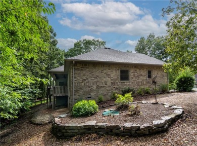 Beautifully landscaped and surrounded by mature trees! This on Bella Vista - Metfield Golf Complex and Country Club in Arkansas - for sale on GolfHomes.com, golf home, golf lot