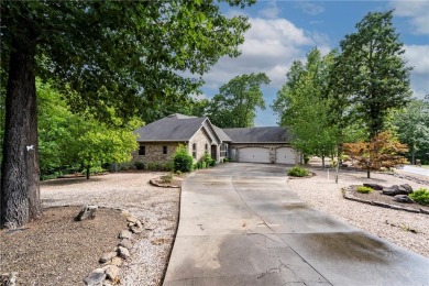 Beautifully landscaped and surrounded by mature trees! This on Bella Vista - Metfield Golf Complex and Country Club in Arkansas - for sale on GolfHomes.com, golf home, golf lot