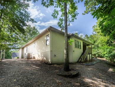 Beautifully landscaped and surrounded by mature trees! This on Bella Vista - Metfield Golf Complex and Country Club in Arkansas - for sale on GolfHomes.com, golf home, golf lot