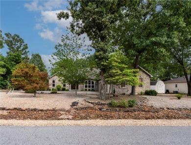 Beautifully landscaped and surrounded by mature trees! This on Bella Vista - Metfield Golf Complex and Country Club in Arkansas - for sale on GolfHomes.com, golf home, golf lot