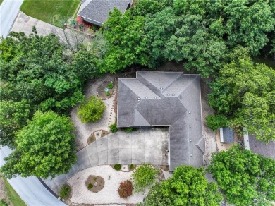 Beautifully landscaped and surrounded by mature trees! This on Bella Vista - Metfield Golf Complex and Country Club in Arkansas - for sale on GolfHomes.com, golf home, golf lot