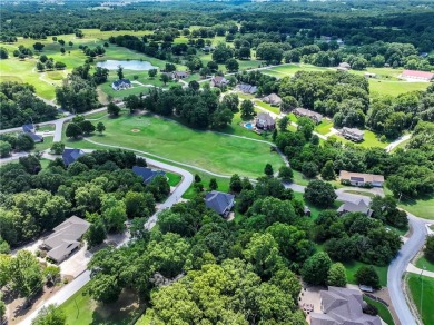 Beautifully landscaped and surrounded by mature trees! This on Bella Vista - Metfield Golf Complex and Country Club in Arkansas - for sale on GolfHomes.com, golf home, golf lot