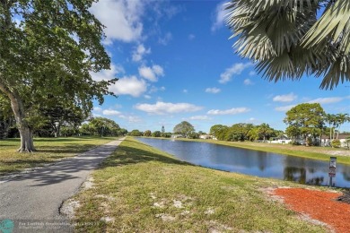 Welcome home to your completely remodeled single family on Palm-Aire Country Club and Resort - Palms in Florida - for sale on GolfHomes.com, golf home, golf lot