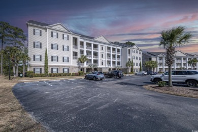 Located in the heart of Murrells Inlet, this top-floor villa on International Club of Myrtle Beach in South Carolina - for sale on GolfHomes.com, golf home, golf lot