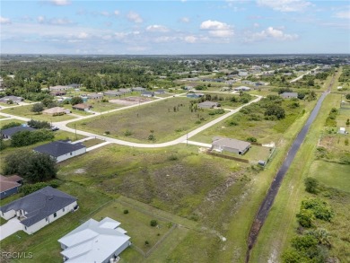 Located in a growing area of Lehigh Acres, this mostly-cleared on Copperhead Golf Club in Florida - for sale on GolfHomes.com, golf home, golf lot