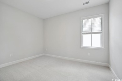 Fall in love with this move-in ready 4-bedroom, 2.5-bath home in on Tidewater Golf Club and Plantation in South Carolina - for sale on GolfHomes.com, golf home, golf lot
