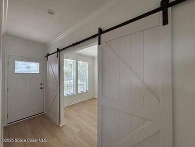 Brand-New 2026 Model Home in Barefoot Bay! Step into modern on Barefoot Bay Golf Course in Florida - for sale on GolfHomes.com, golf home, golf lot