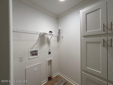 Brand-New 2026 Model Home in Barefoot Bay! Step into modern on Barefoot Bay Golf Course in Florida - for sale on GolfHomes.com, golf home, golf lot