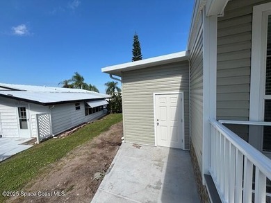 Brand-New 2026 Model Home in Barefoot Bay! Step into modern on Barefoot Bay Golf Course in Florida - for sale on GolfHomes.com, golf home, golf lot