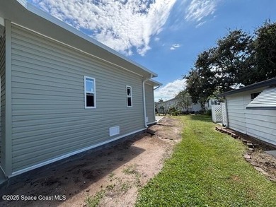 Brand-New 2026 Model Home in Barefoot Bay! Step into modern on Barefoot Bay Golf Course in Florida - for sale on GolfHomes.com, golf home, golf lot