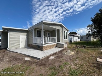 Brand-New 2026 Model Home in Barefoot Bay! Step into modern on Barefoot Bay Golf Course in Florida - for sale on GolfHomes.com, golf home, golf lot
