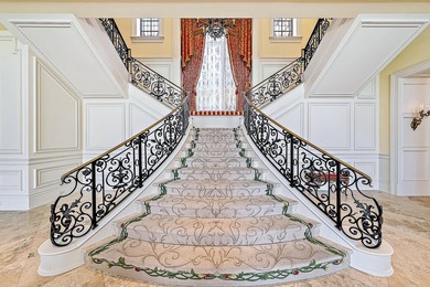 Introducing a palatial waterfront estate on a double lot in the on Jonathans Landing Golf Club in Florida - for sale on GolfHomes.com, golf home, golf lot