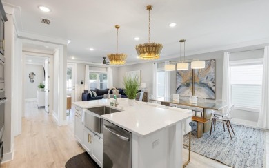 This stunning, highly-upgraded, one-story, 2023-built beach on Sharks Tooth Golf Club in Florida - for sale on GolfHomes.com, golf home, golf lot