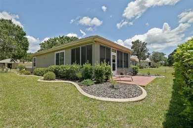 Lovely Kingston Patio home on corner lot with views to the Golf on Eagle Ridge At Spruce Creek Country Club in Florida - for sale on GolfHomes.com, golf home, golf lot
