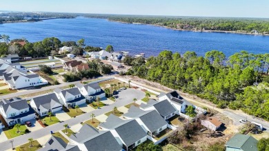 This stunning, highly-upgraded, one-story, 2023-built beach on Sharks Tooth Golf Club in Florida - for sale on GolfHomes.com, golf home, golf lot