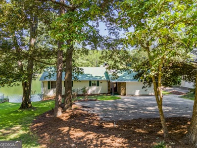 Wake up to sparkling lake views every day in this beautiful 3 on Fairfield Plantation Golf and Country Club in Georgia - for sale on GolfHomes.com, golf home, golf lot