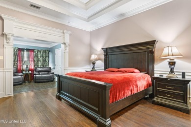 Enjoy timeless elegance and custom craftsmanship in this on Diamondhead Country Club in Mississippi - for sale on GolfHomes.com, golf home, golf lot