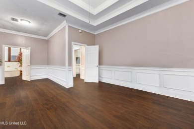 Enjoy timeless elegance and custom craftsmanship in this on Diamondhead Country Club in Mississippi - for sale on GolfHomes.com, golf home, golf lot
