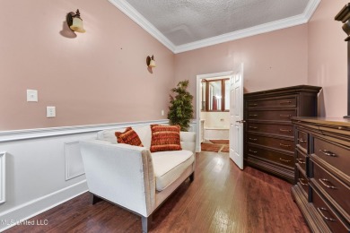 Enjoy timeless elegance and custom craftsmanship in this on Diamondhead Country Club in Mississippi - for sale on GolfHomes.com, golf home, golf lot