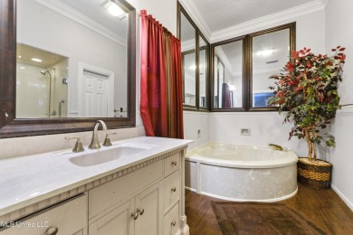 Enjoy timeless elegance and custom craftsmanship in this on Diamondhead Country Club in Mississippi - for sale on GolfHomes.com, golf home, golf lot